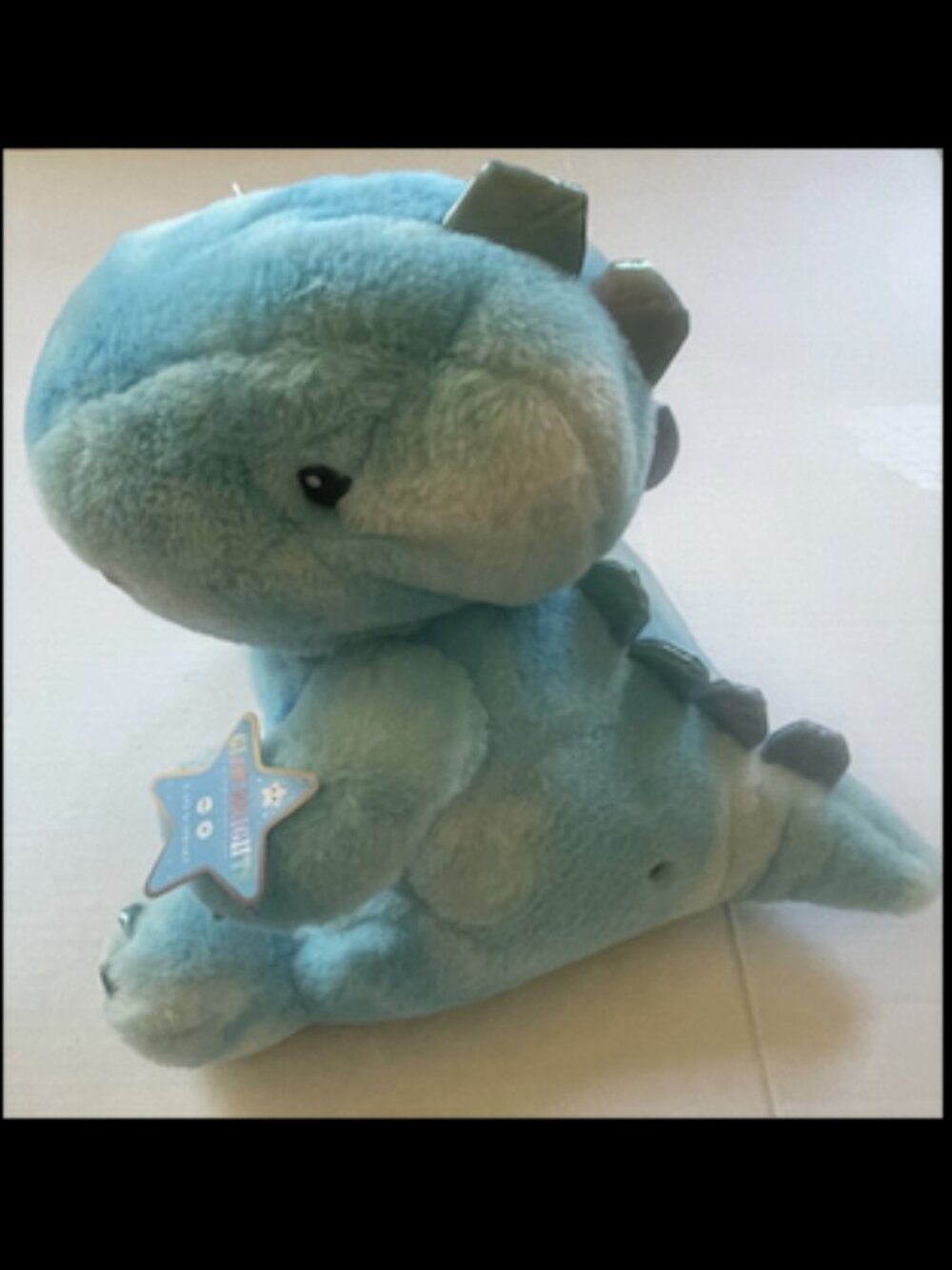 FAO Schwarz Glow Brights Light-Up Blue Dinosaur Plush Toy